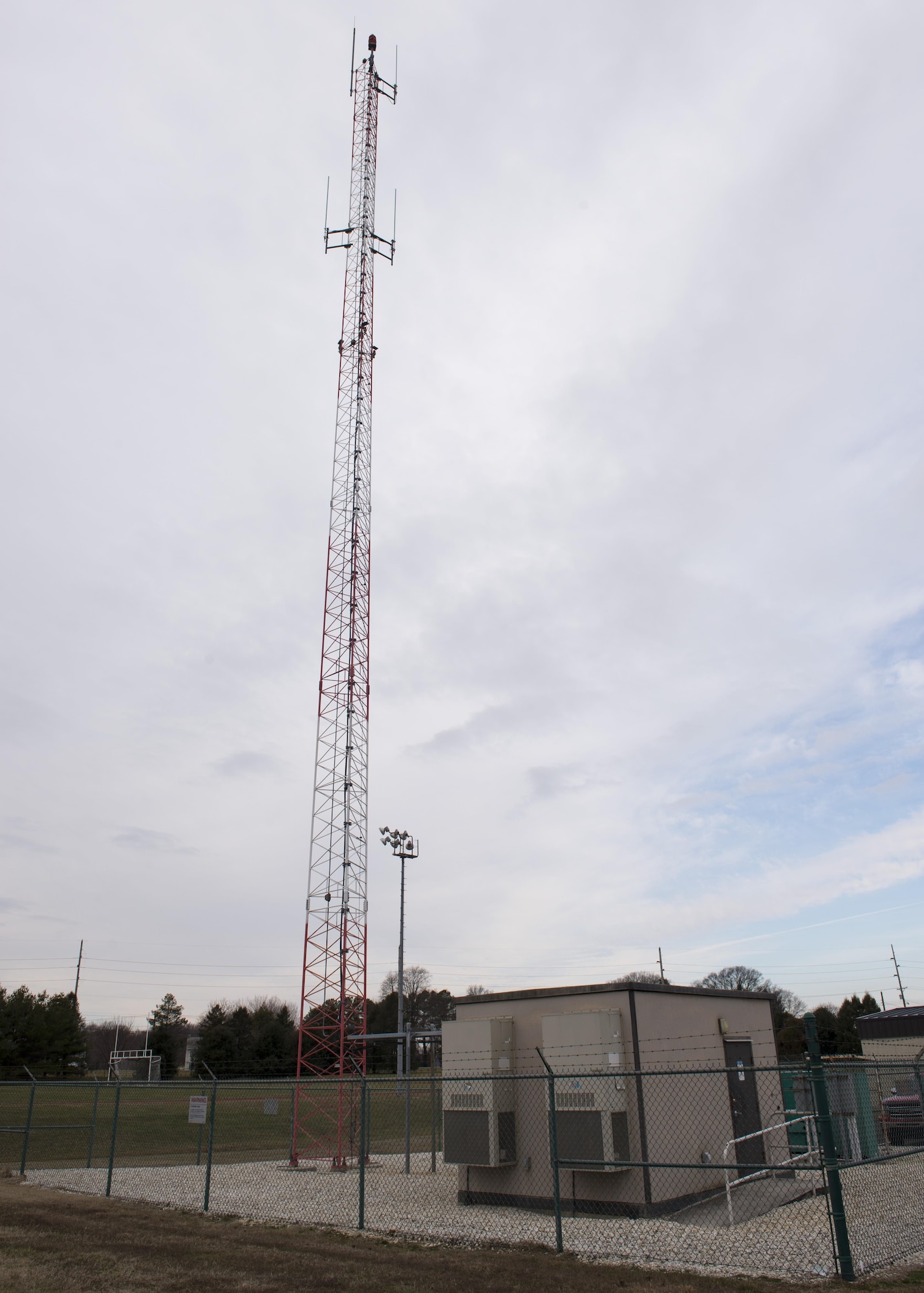 The newly upgraded trunked land mobile radio tower resides on the north end of Dover Air Force Base, Del., Jan. 31, 2017. This tower houses newly upgraded repeater equipment, replacing a 20–year-old system. (U.S. Air Force photo by Senior Airman Zachary Cacicia)
