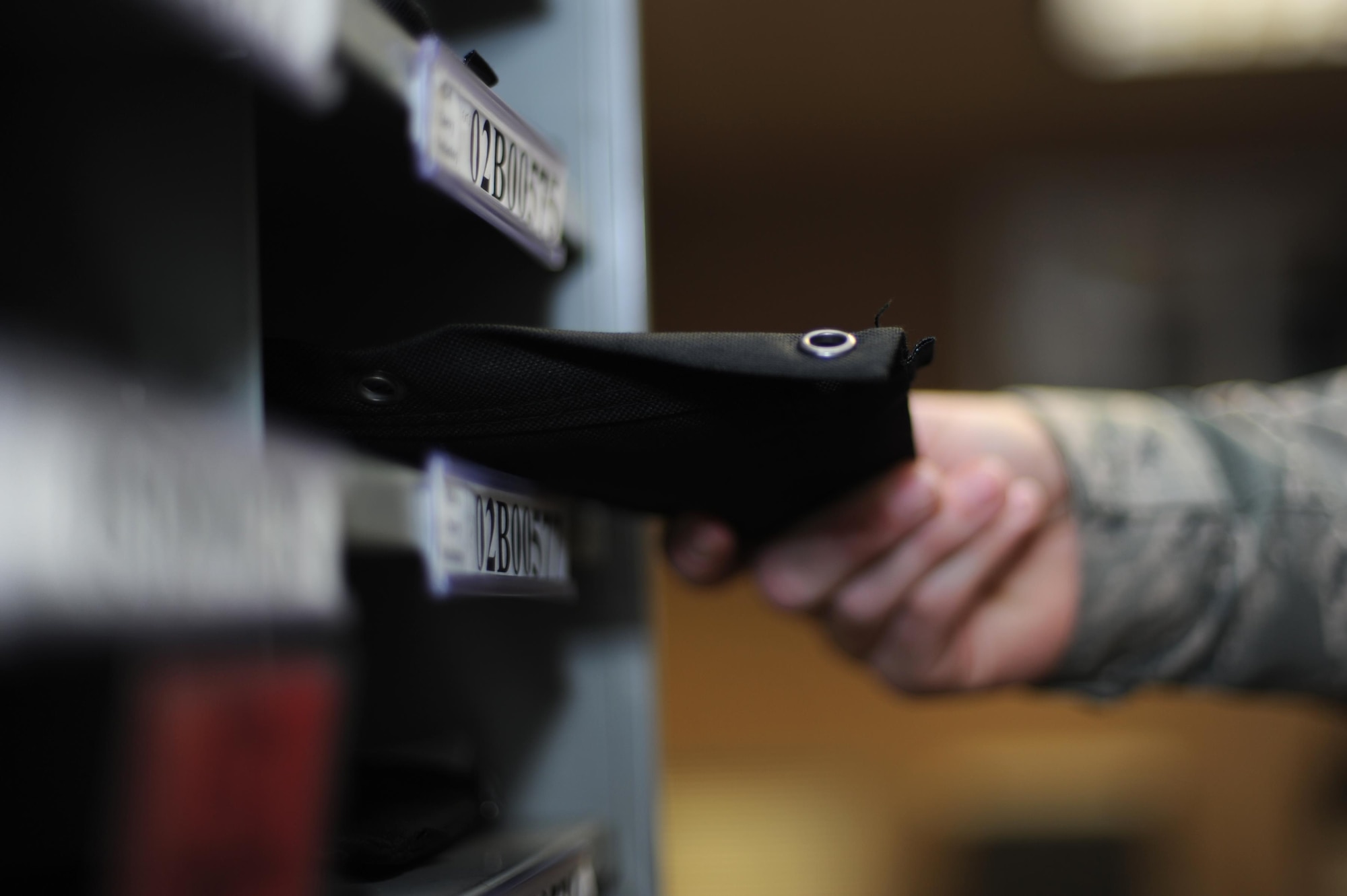 A 19th Logistics Readiness Squadron Vehicle Operations shop operator and dispatcher retrieves a vehicle issue packet Jan. 12, 2017, at Little Rock Air Force Base, Ark. The Vehicle Operations shop is in charge of the dispatch and weekly inspection of government vehicles on base, in addition to driving buses for base tours. (U.S. Air Force photo by Airman 1st Class Grace Nichols)