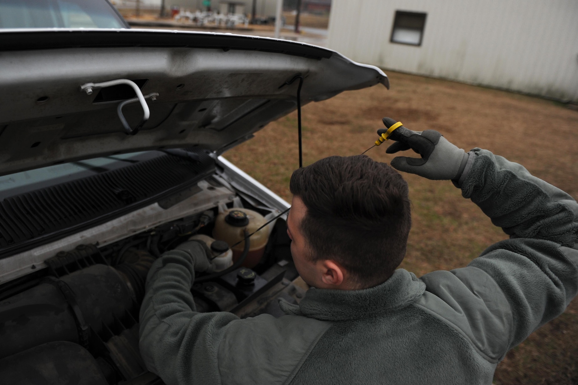 U.S. Air Force Airman 1st Class Vinson Mixon, 19th Logistics Readiness Squadron Vehicle Operations shop operator and dispatcher, checks fluid levels in a vehicle Jan. 12, 2017, at Little Rock Air Force Base, Ark. Every vehicle under the care of the Vehicle Operations shop is inspected every seven days to ensure it’s operating at optimum efficiency. (U.S. Air Force photo by Airman 1st Class Grace Nichols)