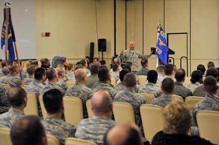 Col. Jimmy Canlas, 437th Airlift Wing (AW) commander, addresses the crowd during the 437th AW commander’s call in the Air Base Club Jan. 22, 2016. During the commander’s call Canlas talked about the wing’s accomplishments over the past year, how to keep the momentum they have going and took questions from attendees.