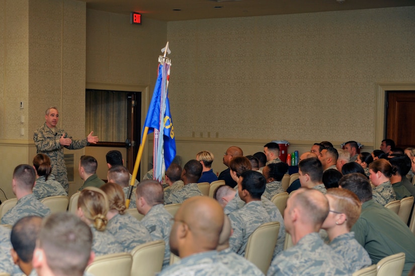 Chief Master Sgt. Chief Master Sgt. Kristopher Berg, right, 437th Airlift Wing (AW) command chief, addresses the crowd during the 437th AW commander’s call in the Air Base Club Jan. 22, 2016. During the commander’s call leadership talked about the wing’s accomplishments over the past year, how to keep the momentum they have going and took questions from attendees.