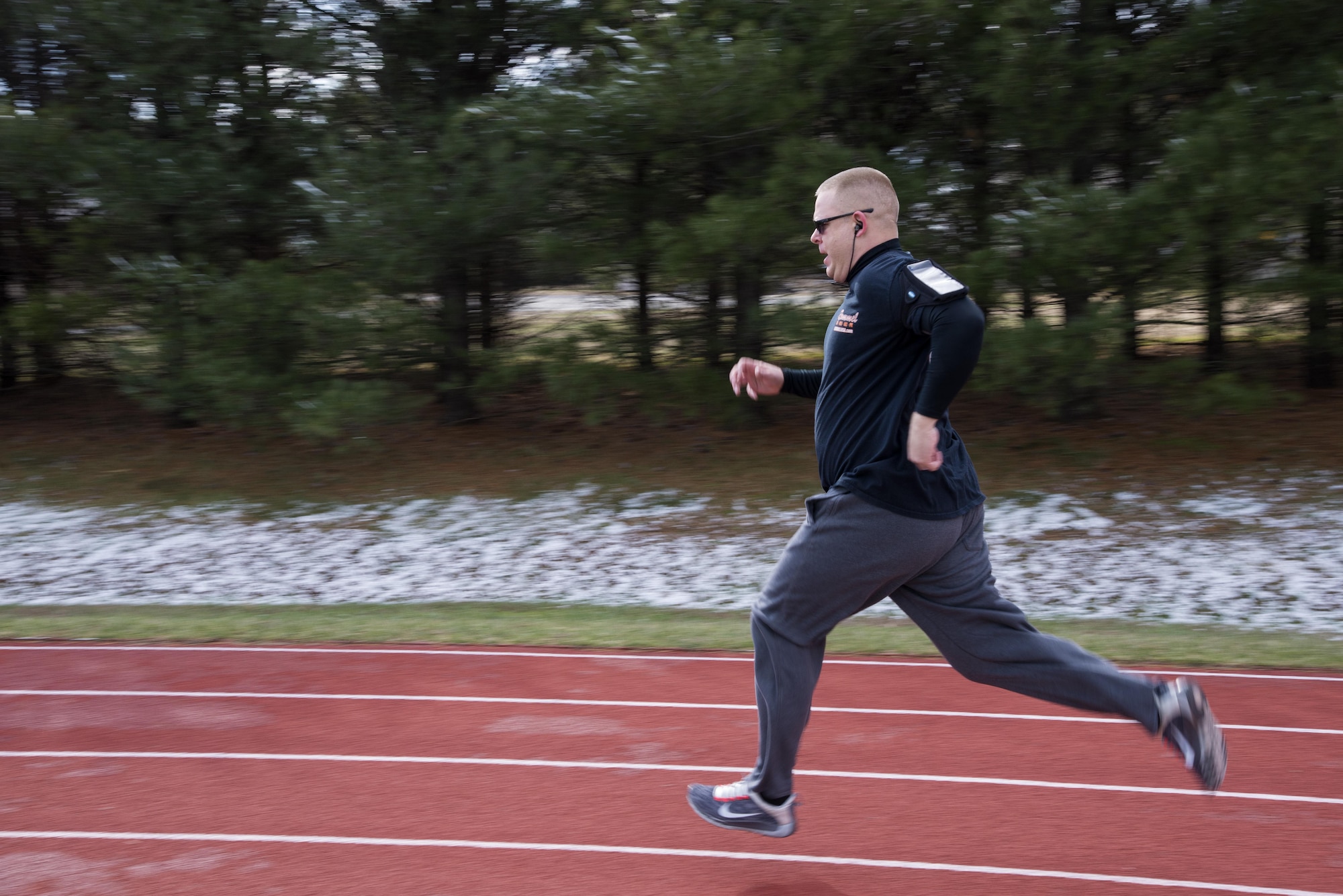 Master Sgt. Estil Fields, 436th Maintenance Group self-assessment program manager, completes a lap on the track during a 90 Plus class Jan. 30, 2017, at Dover Air Force Base, Del. The fitness center hosts this class at 6 a.m. and noon each Monday, Wednesday and Friday. (U.S. Air Force photo by Senior Airman Aaron J. Jenne)