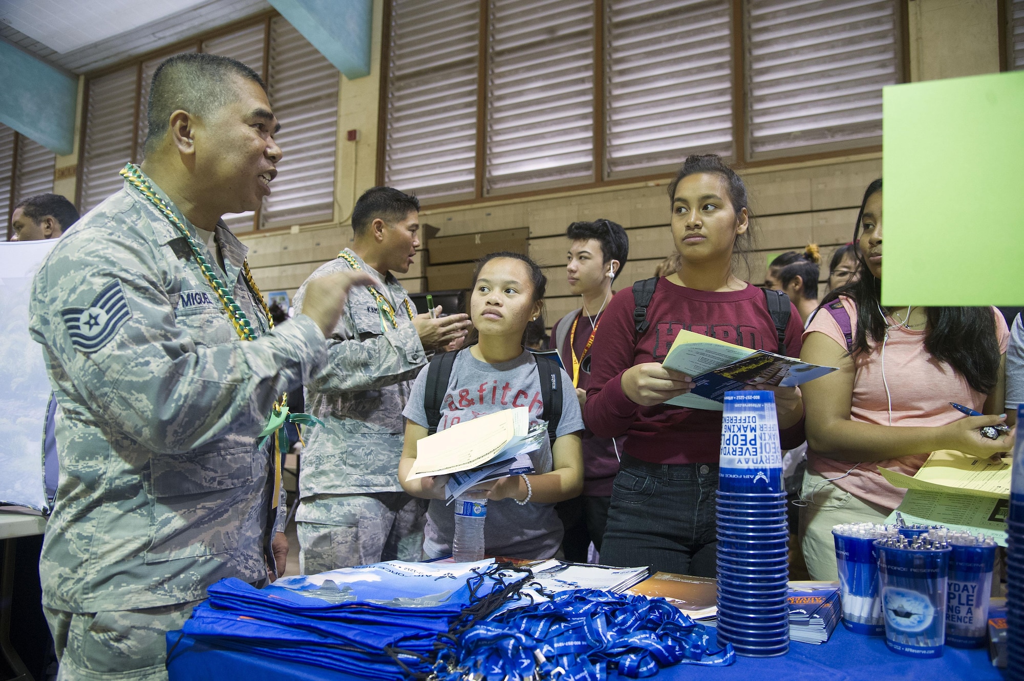 U.S. Air Force Master Sgt. Josephine Taitague, 624th Regional Support Group, talks with students during a career fair at Kaimuki High School, Honolulu, Hawaii, Jan 27, 2017. Eleven Airmen from the 624th Regional Support Group volunteered alongside the local recruiting station in support of the fair, which provided career guidance to more than 800 Hawaii students. Located on Oahu and Guam, and a component of the Air Force Reserve, the 624th Regional Support Group's mission is to deliver mission essential capability through combat readiness, quality management and peacetime deployments in the Pacific area of responsibility. (U.S. Air Force photo by Master Sgt. Theanne Herrmann) 