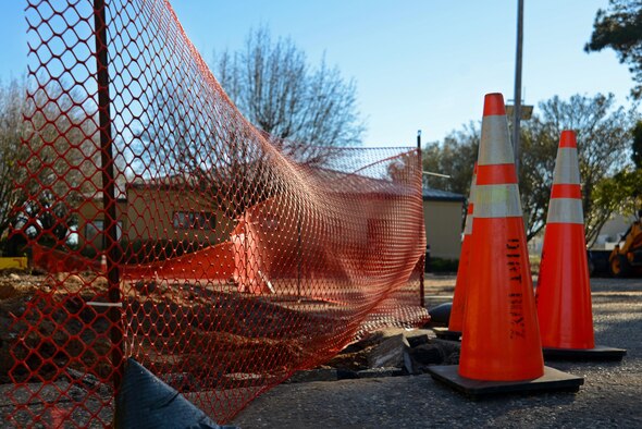 Cones and a safety fence surround a construction area at a developing fire station project at Shaw Air Force Base, S.C., Jan. 25, 2017. The project includes expanding the parking lot and renovating the interior of an existing building to accommodate five 20th Civil Engineer Squadron firefighters.
(U.S. Air Force photo by Airman 1st Class Kathryn R.C. Reaves)