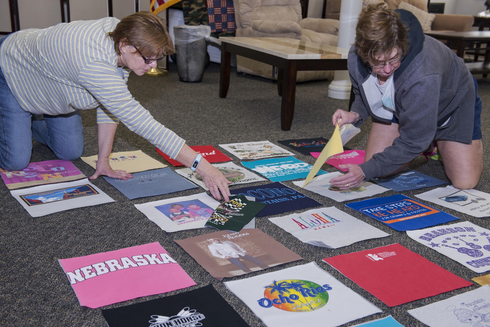 Gold Star Family members lay out T-shirt quilt panels Jan. 24, 2017, at Joint Base San Antonio-Fort Sam Houston. The term "Gold Star" describes a family member who has lost a loved one in military service and is a tradition that began during World War I. (U.S. Air Force photo by Senior Airman Stormy Archer)