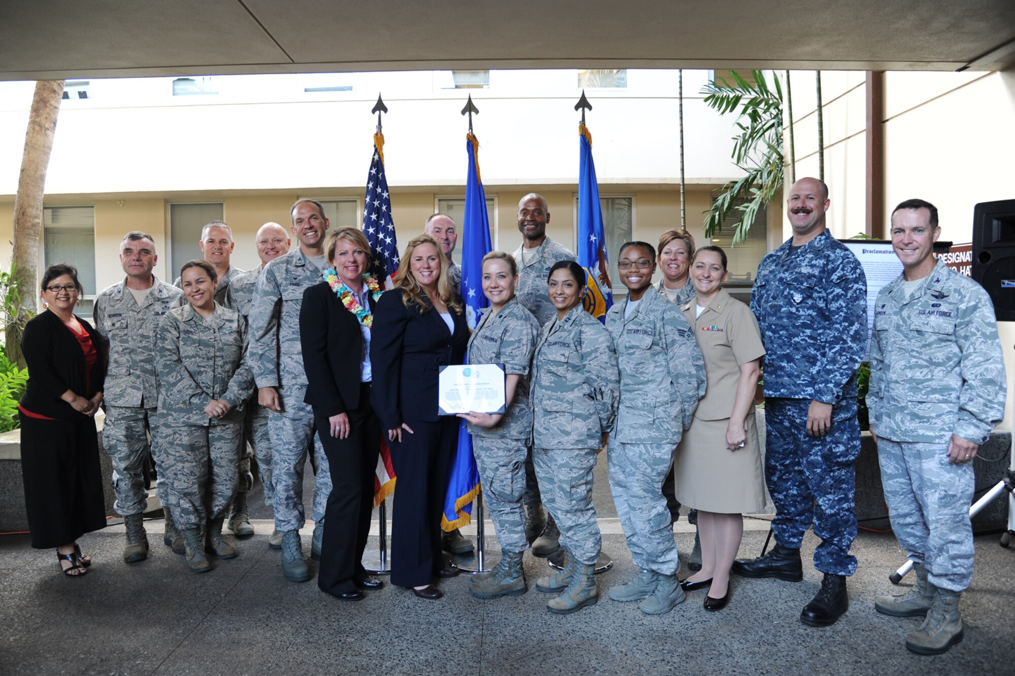 Key players for the Joint Base Pearl Harbor-Hickam mental health clinics accept a certificate of appreciation from Dr. Keita Franklin, Defense Suicide Prevention Office director, at Joint Base Pearl Harbor-Hickam, Hawaii, Jan. 30, 2017. The 15th Wing clinic was recognized for its superior efforts to prevent suicide in Sept. 2016. (U.S. Air Force photo by 1st Lt. Kaitlin Daddona/Released)