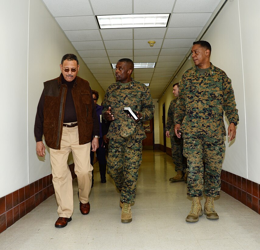 Col. James C. Carroll (center) commanding officer, Marine Corps Logistics Base Albany, explains the impact of the tornado to Sanford D. Bishop, Jr., U.S. Representative for Georgia's 2nd congressional district, during a tour of the installation while Maj. Gen. Craig C. Crenshaw, commanding general, Marine Corps Logistics Command, looks on, Jan. 25. 