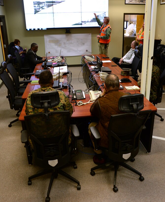Government and military officials receive a brief about the tornado damage Marine Corps Logistics Base Albany, Jan. 25. A line of strong thunderstorms produced a tornado that passed through the Albany, Georgia, community and Marine Corps Logistics Base Albany carving a path of destruction leaving the landscape strewn with broken trees, downed power lines and damaged structures, Jan. 22.