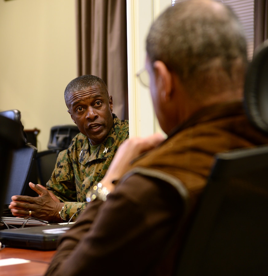 Col. James C. Carroll, commanding officer, Marine Corps Logistics Base Albany, updates Sanford D. Bishop, Jr., U.S. Representative for Georgia’s 2nd congressional district, on the tornado’s destruction and clean up efforts taking place aboard the installation, Jan. 25. 