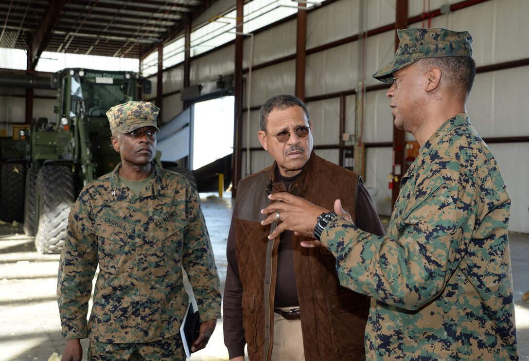 Maj. Gen. Craig C. Crenshaw (far right) commanding general, Marine Corps Logistics Command, explains the impact of the tornado to Sanford D. Bishop, Jr., U.S. Representative for Georgia’s 2nd congressional district, during a tour of the installation while Col. James C. Carroll, commanding officer, Marine Corps Logistics Base Albany, looks on, Jan. 25. 