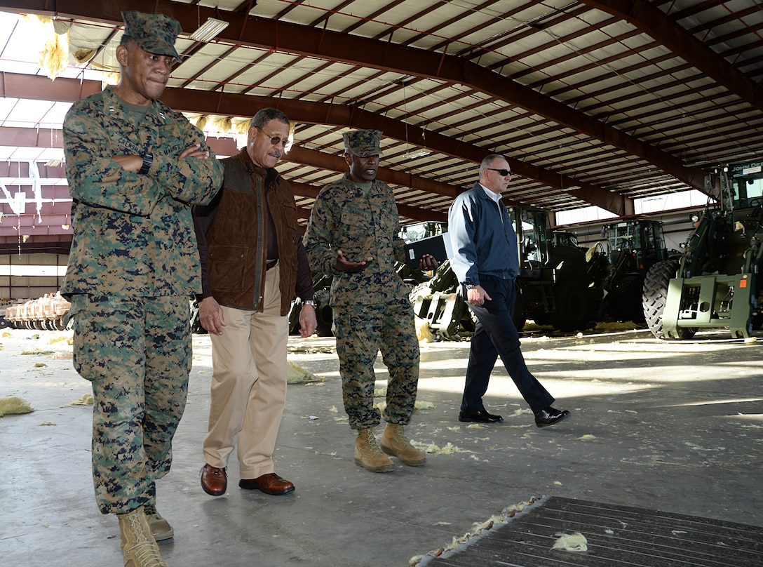Col. James C. Carroll, commanding officer, Marine Corps Logistics Base Albany, explains the impact of the tornado to Sanford D. Bishop, Jr., U.S. Representative for Georgia’s 2nd congressional district, during a tour of the installation with Maj. Gen. Craig C. Crenshaw (far left), commanding general, Marine Corps Logistics Command, and Kent Morrison (far right) executive director, MCLB Albany, Jan. 25. 