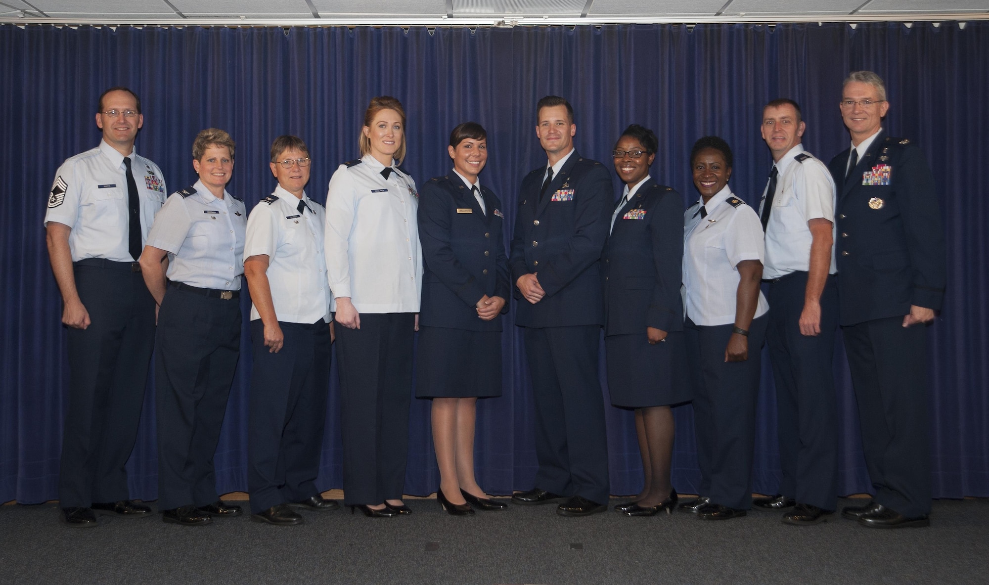 Graduates from the Tampa Nurse Transition Program pause for a photo with MacDill Air Force Base, Fla., leadership at Tampa General Hospital, Jan. 26, 2017. The goal of the program is to ease the transition of novice and inexperienced nurses to competent active duty nurses. (U.S. Air Force photo by Airman 1st Class Mariette Adams)