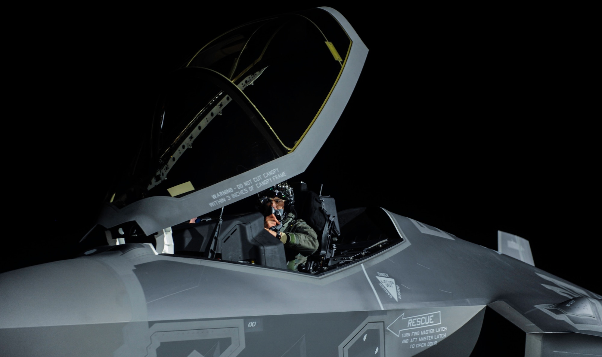 A pilot assigned to the 388th Fighter Wing, Hill Air Force Base, Utah, performs preflight checks in an F-35A Lightning II before a night operation Red Flag 17-1 on Nellis Air Force Base, Nev., Jan. 24, 2017. Aircraft and personnel deploy to Nellis AFB for Red Flag under the Air Expeditionary Force concept and make up the exercise’s “Blue” forces. (U.S. Air Force photo by Airman 1st Class Kevin Tanenbaum/Released)