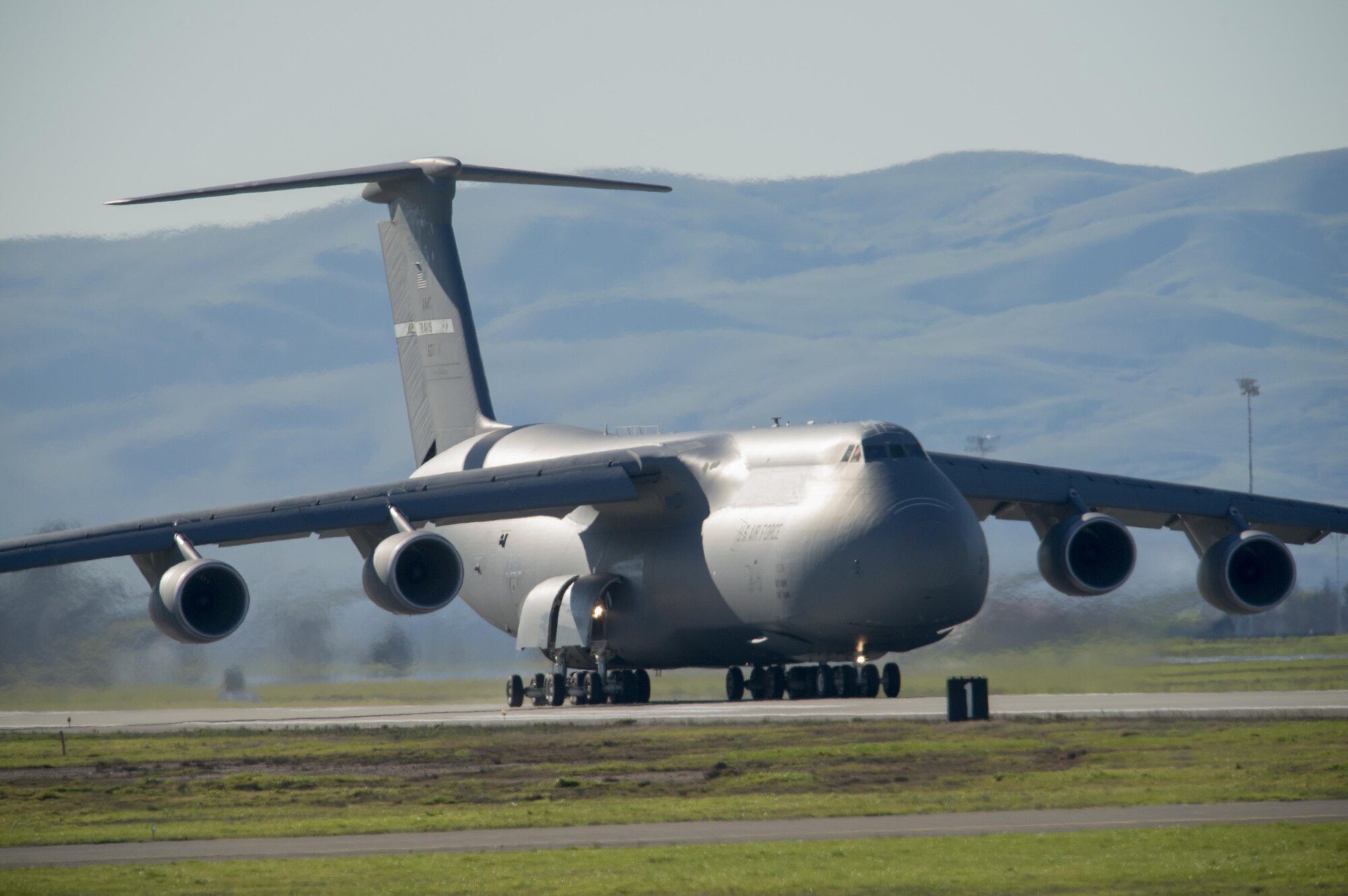 A C-5M Super Galaxy takes off at Travis Air Force Base, Calif., Jan. 13, 2017. Aircrews fly the new M-model around the world supporting Department of Defense missions with improved capabilities such as fuel efficiency, reduced noise and greater payloads. The Travis AFB mission provides Rapid Global Mobility quickly and decisively to locations all around the globe. (U.S. Air Force photo/ Heide Couch)