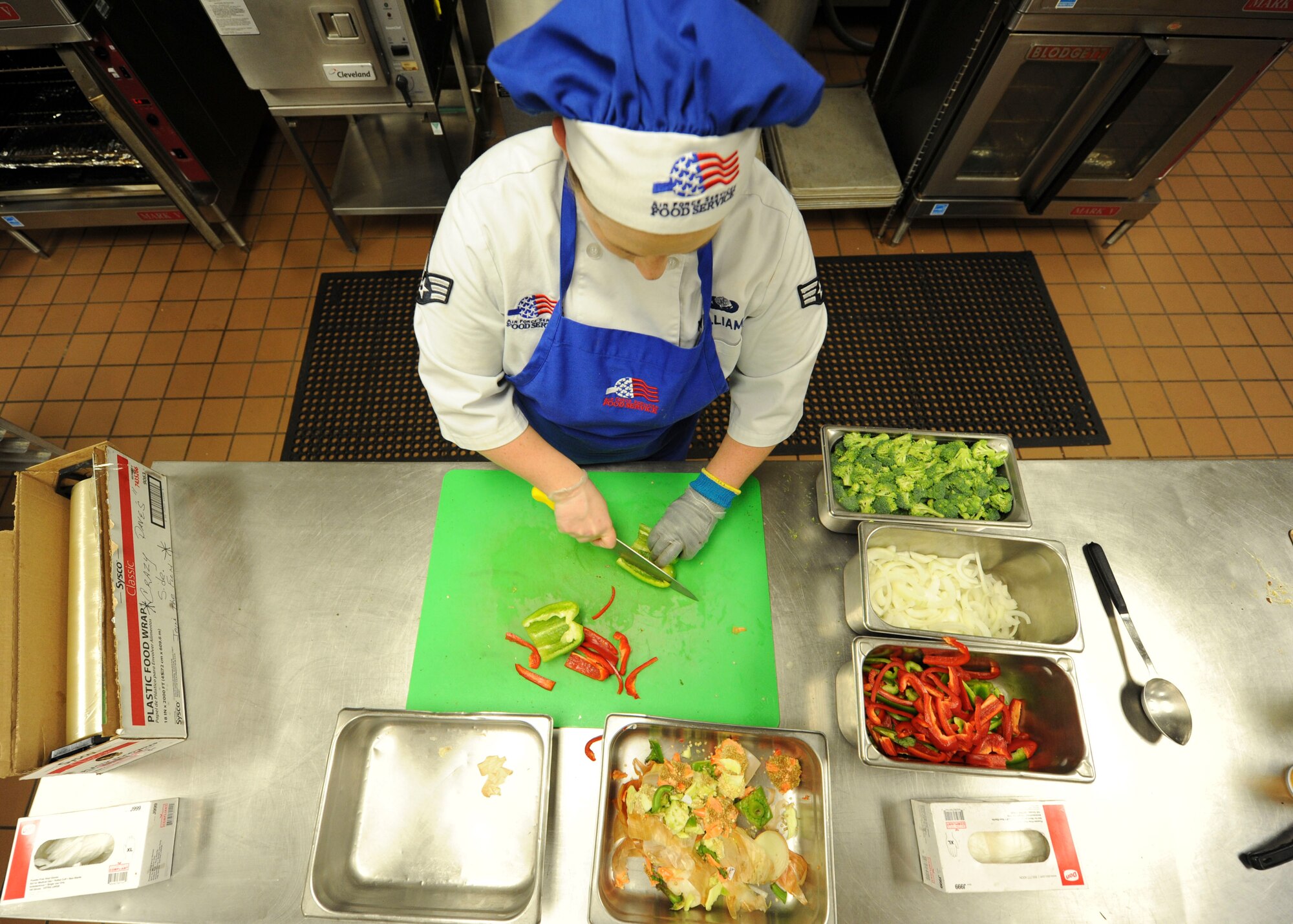 Senior Airman Amanda Williams, a food service journeyman assigned to the 28th Force Support Squadron prepares fresh vegetables for the lunch rush at Ellsworth Air Force Base, S.D., Oct. 6, 2016. Ellsworth recently became the Air Force Global Strike Command finalist for the John L. Hennessy award, which recognizes the best dining facility in the Air Force. (U.S. Air Force photo by Airman 1st Class Randahl J. Jenson)