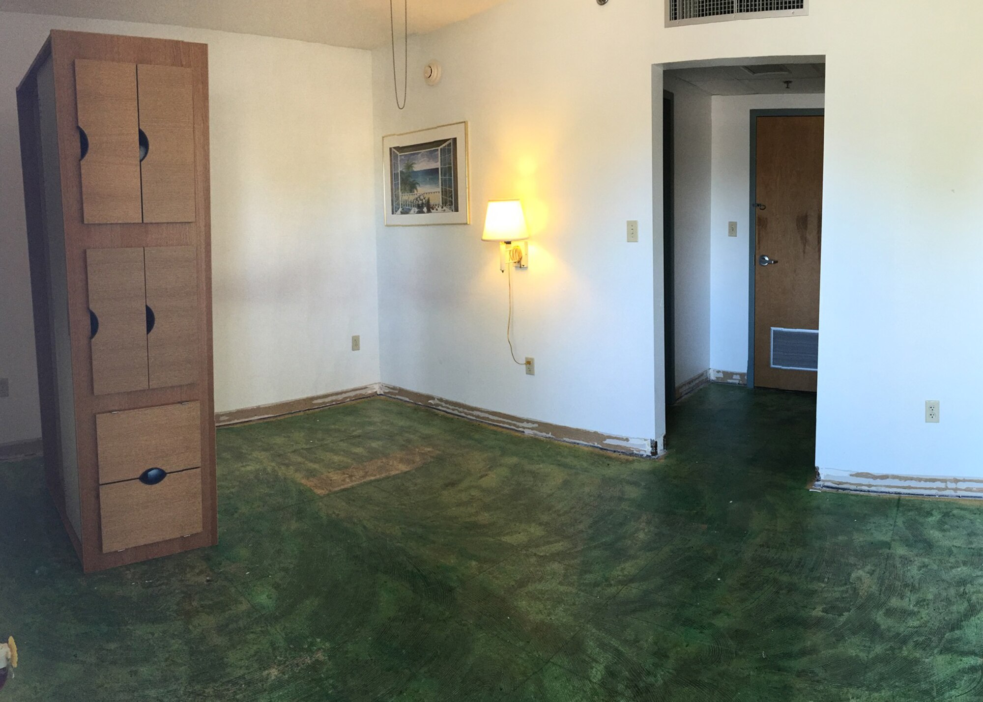 A dorm room is stripped of its furniture and flooring on Tyndall Air Force Base, Fla. Many dorm rooms received renovations, including new flooring and furniture. (Courtesy photo)