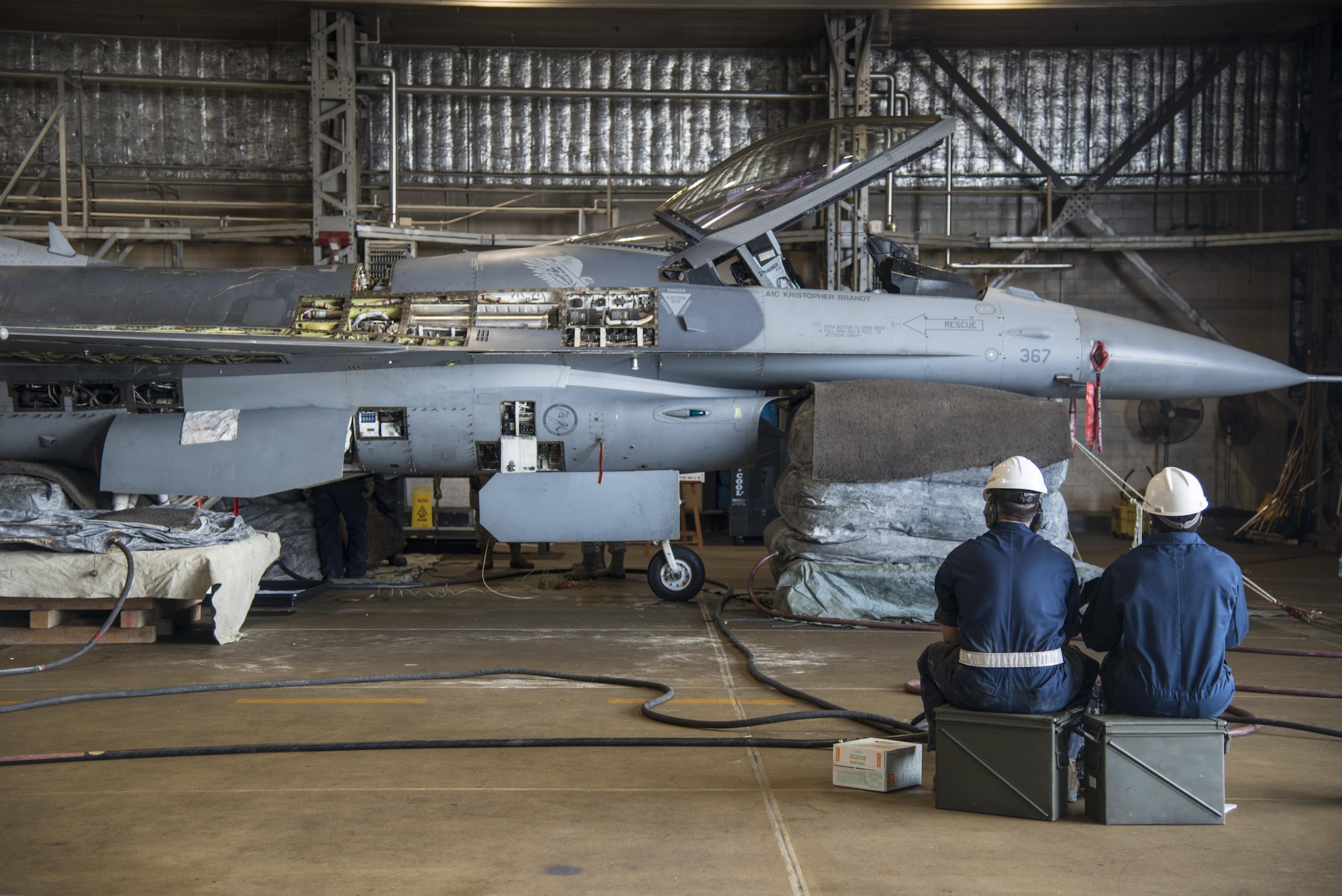 Airmen with the 35th Maintenance Squadron crashed, damaged, disabled aircraft recovery unit fill lifting bags with a pneumatic control console at Misawa Air Base, Japan, Jan. 28, 2017. During a lifting bag procedure, a pneumatic control console is used to pump air into each of the four bags. Once the bags are completely full and the aircraft is lifted the landing gear can be properly dislodged. (U.S. Air Force photo by Senior Airman Brittany A. Chase)