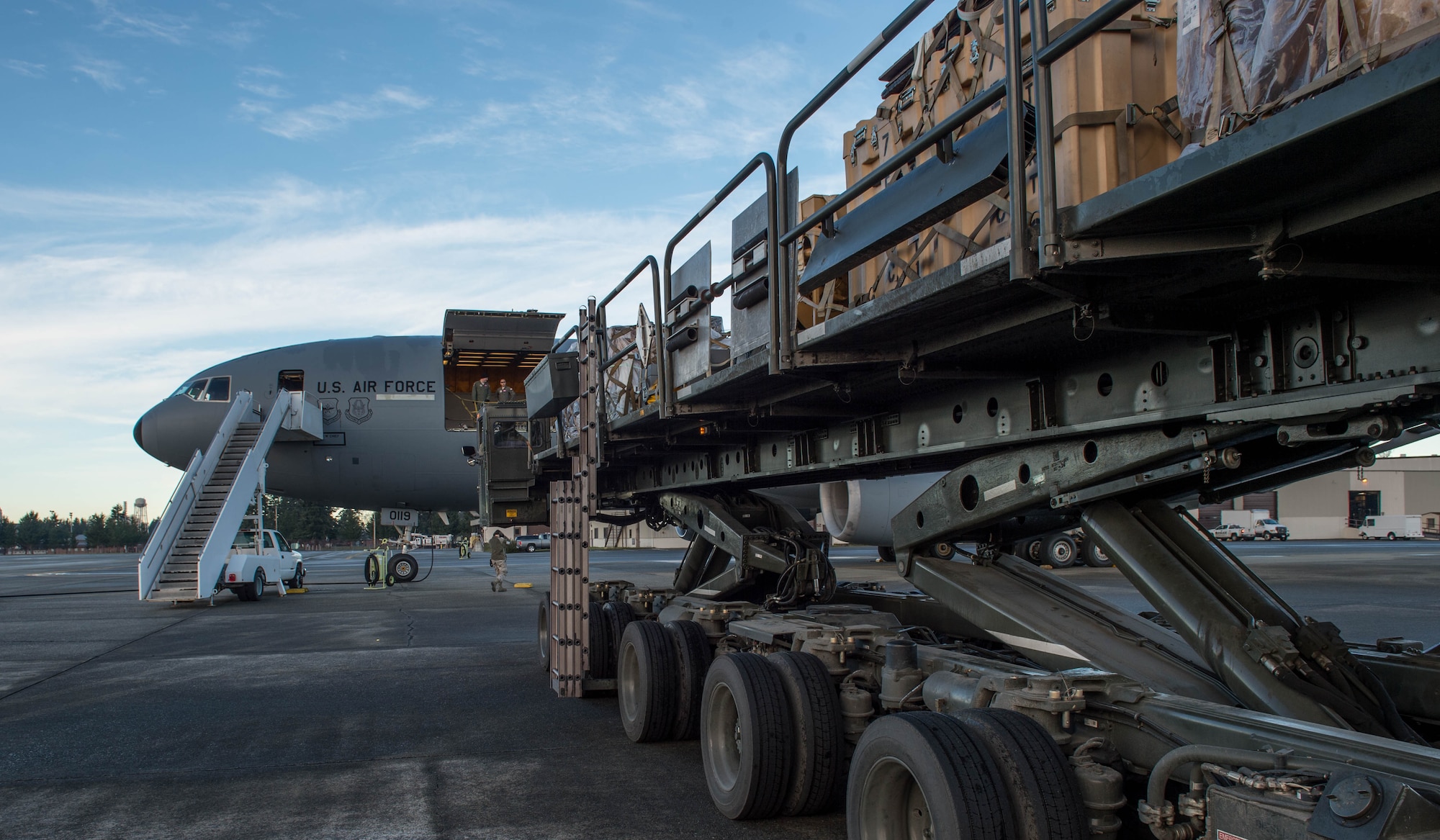 Aerial port Airmen from the 821st Contingency Response Group, use a K-loader to load cargo onto a KC-10 Extender aircraft from Travis Air Force Base, Calif., Jan. 23, 2017, at Joint Base Lewis-McChord, Washington. Airmen from the 821st Contingency Response Group, exercised their capability to support humanitarian efforts during exercise Dragon Breath at JBLM and Fairchild Air Force Base. (U.S. Air Force photo by Staff Sgt. Robert Hicks)
