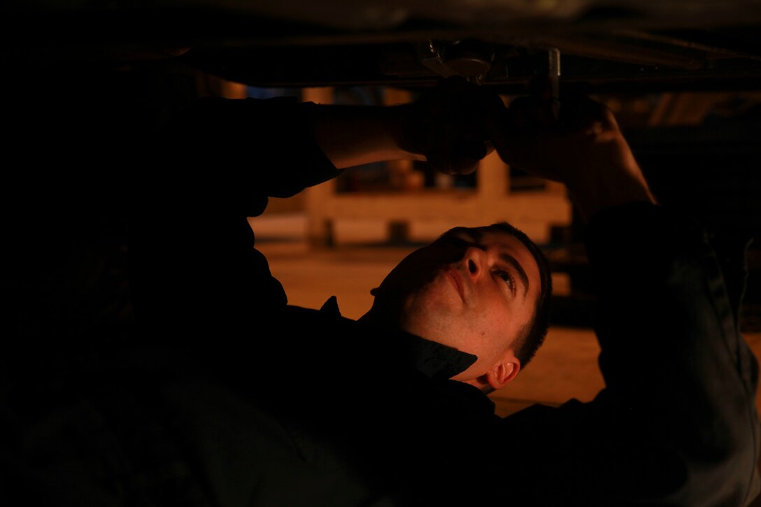 Sgt. Leonard S. Yost inspects repaired vehicles during a reservist training period, Jan. 24, 2017, at Camp Kinser, Okinawa, Japan. The training period was used to integrate reserve and active duty Marines to share knowledge and ideas to improve work productivity. Yost, a native of Hubert, North Carolina, is an intermediate automotive mechanic with Transportation Services Company, Combat Logistics Battalion 25, Combat Logistics Regiment 45, 4th Marine Logistics Group, currently working with 3rd Maintenance Battalion, Combat Logistics Regiment 35, 3rd Marine Logistics Group, III Marine Expeditionary Force. (U.S. Marine Corps Photo by Lance Cpl. Jonah Baase)