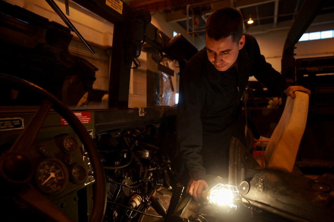 Sgt. Leonard S. Yost inspects vehicles repaired during a reservist training period, Jan. 24, 2017, at Camp Kinser, Okinawa, Japan. The training period was used to integrate reserve and active duty Marines to share knowledge and ideas to improve work productivity. Yost, a native of Hubert, North Carolina, is an intermediate automotive mechanic with Transportation Services Company, Combat Logistics Battalion 25, Combat Logistics Regiment 45, 4th Marine Logistics Group, currently working with 3rd Maintenance Battalion, Combat Logistics Regiment 35, 3rd Marine Logistics Group, III Marine Expeditionary Force. (U.S. Marine Corps Photo by Lance Cpl. Jonah Baase)