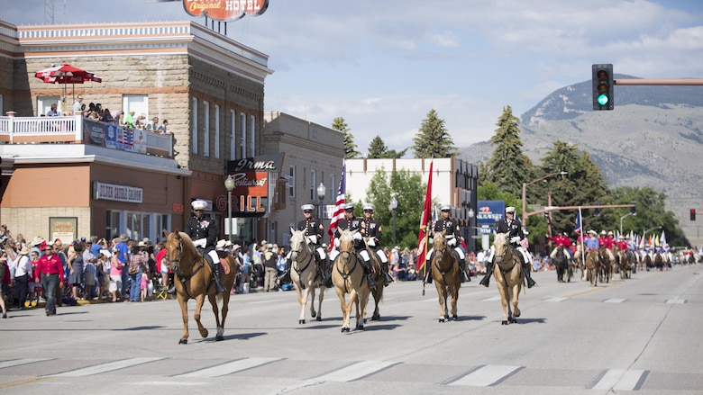 The Marine Corps' Mounted Color Guard, led by Col. Sekou S. Karega, commanding officer of Marine Corps Logistics Base Barstow, present colors and participate in the parade and rodeo held annually in Cody, WY., July 4. The rodeo and parade are the hallmark of the town's Independence Day festivities.
