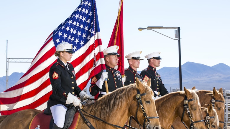 The Marine Corps' Mounted Color Guard, houses out of Marine Corps Logistics Base Barstow's Yermo Annex, post for a portrait, Nov. 8. Left to right: Sgt. Monica Hilpisch, Sgt. Moses Machuca, Sgt. Terry Barker and Sgt. Jacob Cummins.