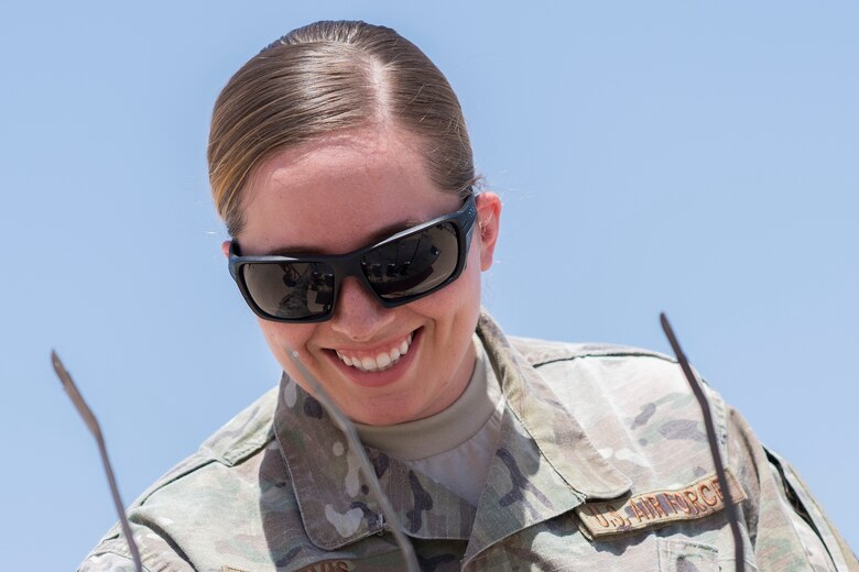 Staff Sgt. Madeline Davis, 332nd Aircrew Flight Equipment technician, inspects radios June 12, 2017, in Southwest Asia. Members of AFE shop manage a variety of gear including helmets, G-suits and night vision goggles. (U.S. Air Force photo/Senior Airman Damon Kasberg)
