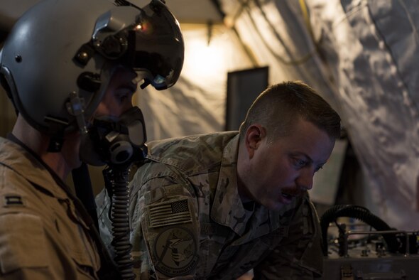 Senior Airman Aarons Jacobs, 332nd Aircrew Flight Equipment technician runs a diagnostics test on a helmet to ensure it functions properly June 12, 2017, in Southwest Asia. The AFE shop manages more than 500 pieces of equipment essential for pilots to complete their mission. (U.S. Air Force photo/Senior Airman Damon Kasberg)