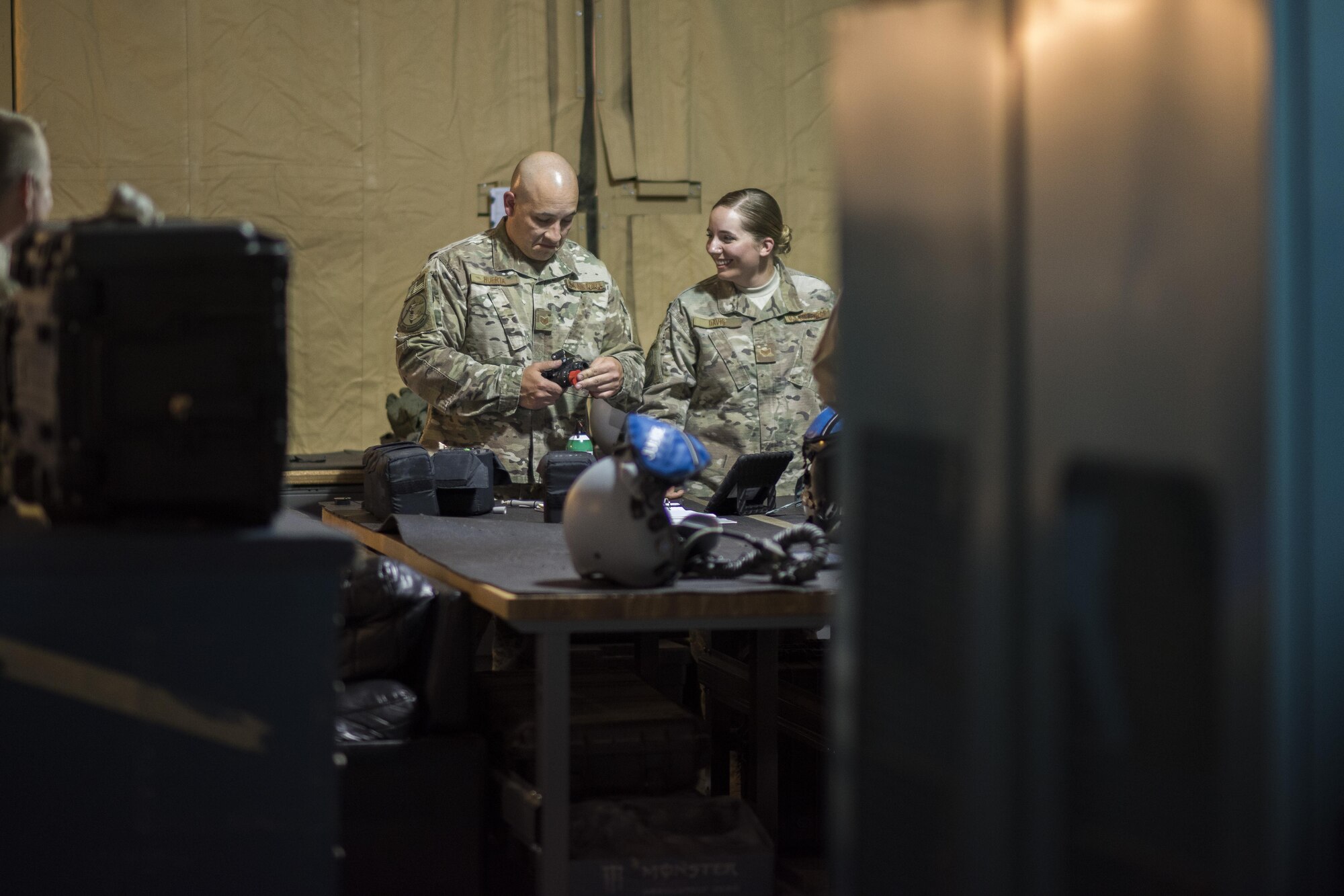 Tech. Sgt. Todd Huerta, 332nd Aircrew Flight Equipment non-commissioned officer in charge, finishes inspecting a pair of night vision goggles June 12, 2017, in Southwest Asia. After every mission, pilots return their equipment to the AFE shop where it is inspected, maintained and stored until their next flight. (U.S. Air Force photo/Senior Airman Damon Kasberg)