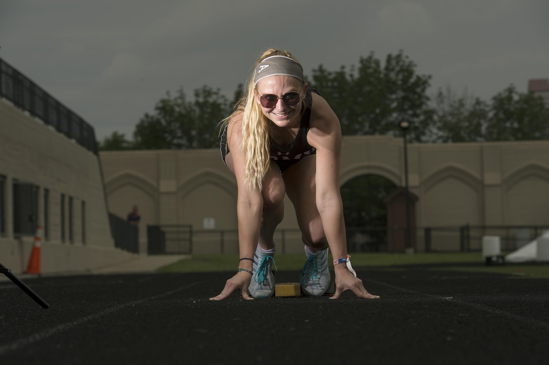 Army Staff Sgt. Megan Grudzinski poses for a photo in the starting blocks during practice for the 2017 Department of Defense Warrior Games in Chicago, June 30, 2017. DoD photo by EJ Hersom