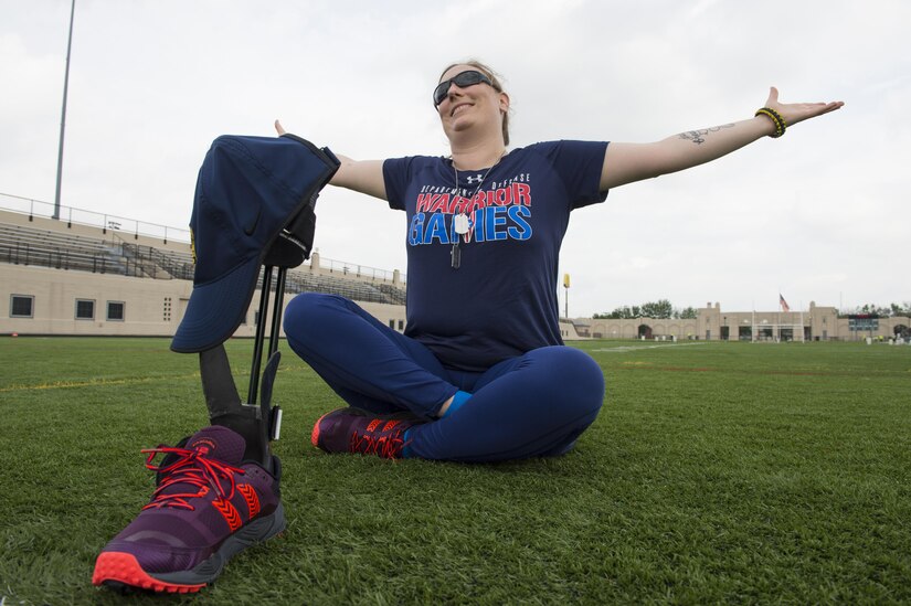 Navy Petty Officer 1st Class Andrea Dubus reacts to a friend while sitting for a portrait for the 2017 Department of Defense Warrior Games in Chicago, June 30, 2017. The DoD Warrior Games are an annual event allowing wounded, ill and injured service members and veterans to compete in Paralympic-style sports. DoD photo by EJ Hersom