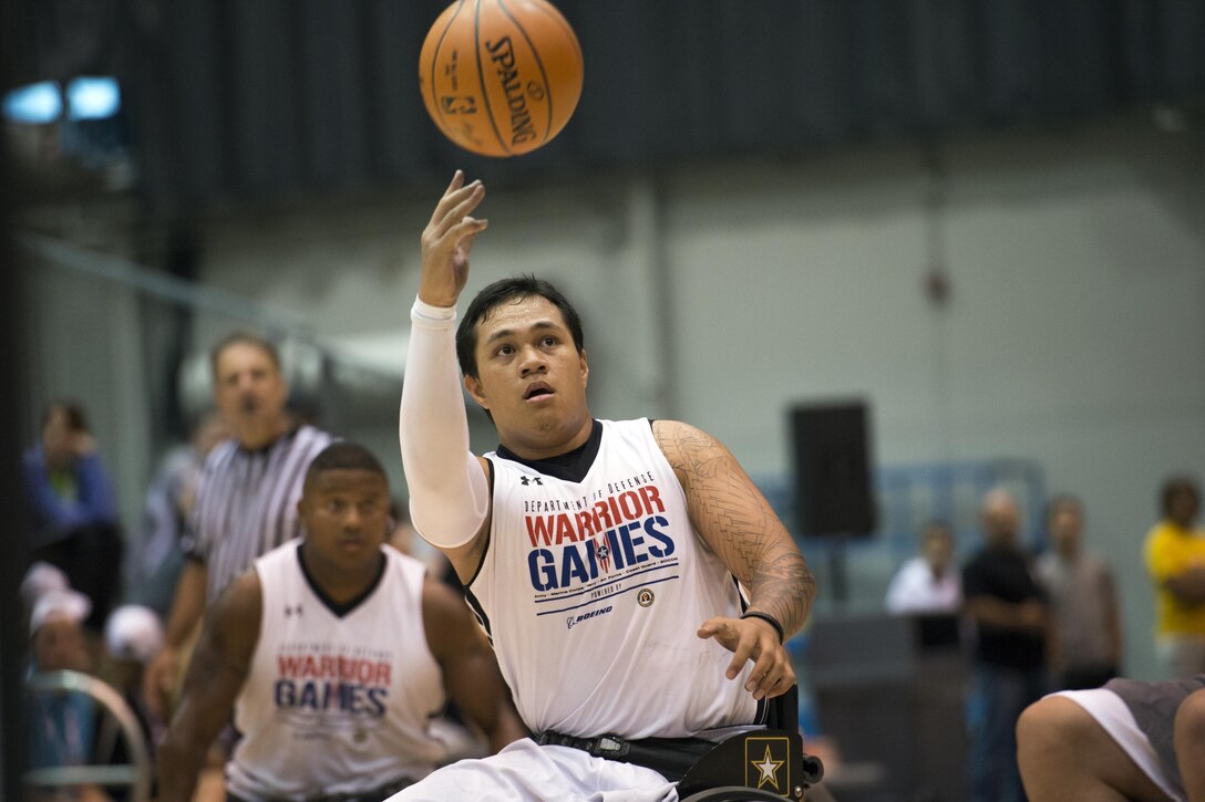 Army Spc. Jarred Vaina shoots a layup during the wheelchair basketball preliminaries at the 2017 DoD Warrior Games in Chicago, June 30, 2017. The DoD Warrior Games are an annual event allowing wounded, ill and injured service members and veterans to compete in Paralympic-style sports. DoD photo by EJ Hersom