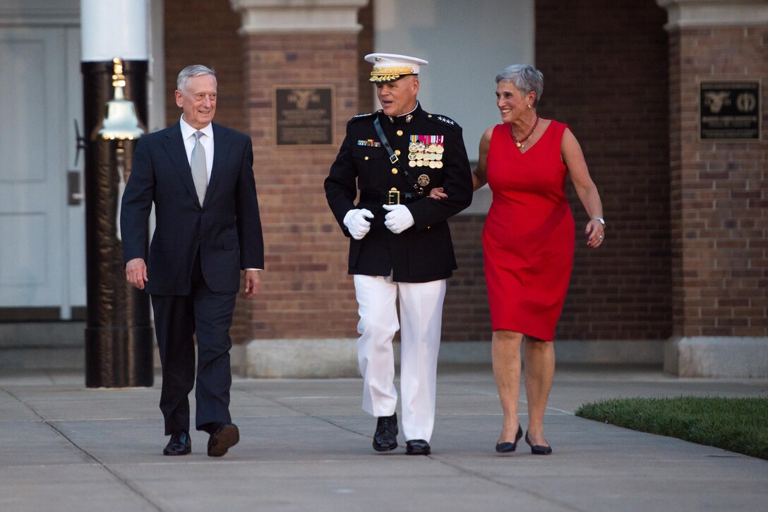 Defense Secretary Jim Mattis walks with Marine Corps Commandant Gen. Robert B. Neller and his wife D'Arcy, while attending an evening parade as the invited guest of honor at the Marine Barracks in Washington, D.C., June 30, 2017. DoD photo by Army Sgt. Amber I. Smith
