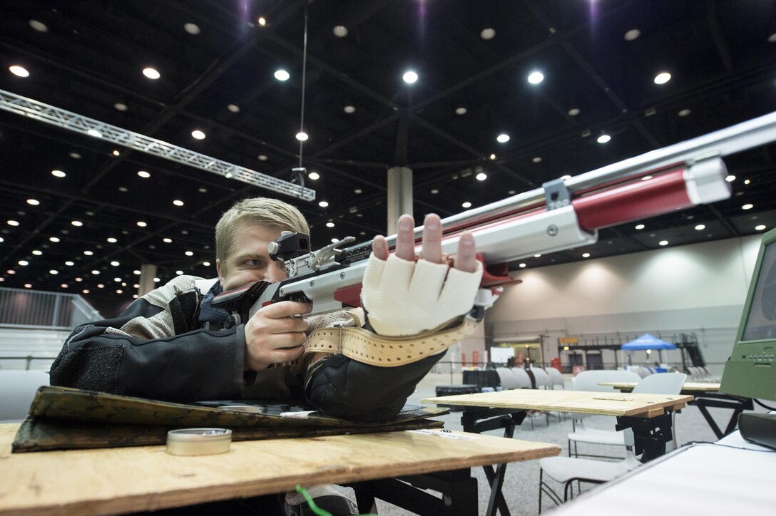 Australian army Pvt. Callum Rush fires an air rifle during practice for the 2017 Department of Defense Warrior Games in Chicago, June 30, 2017. DoD photo by EJ Hersom