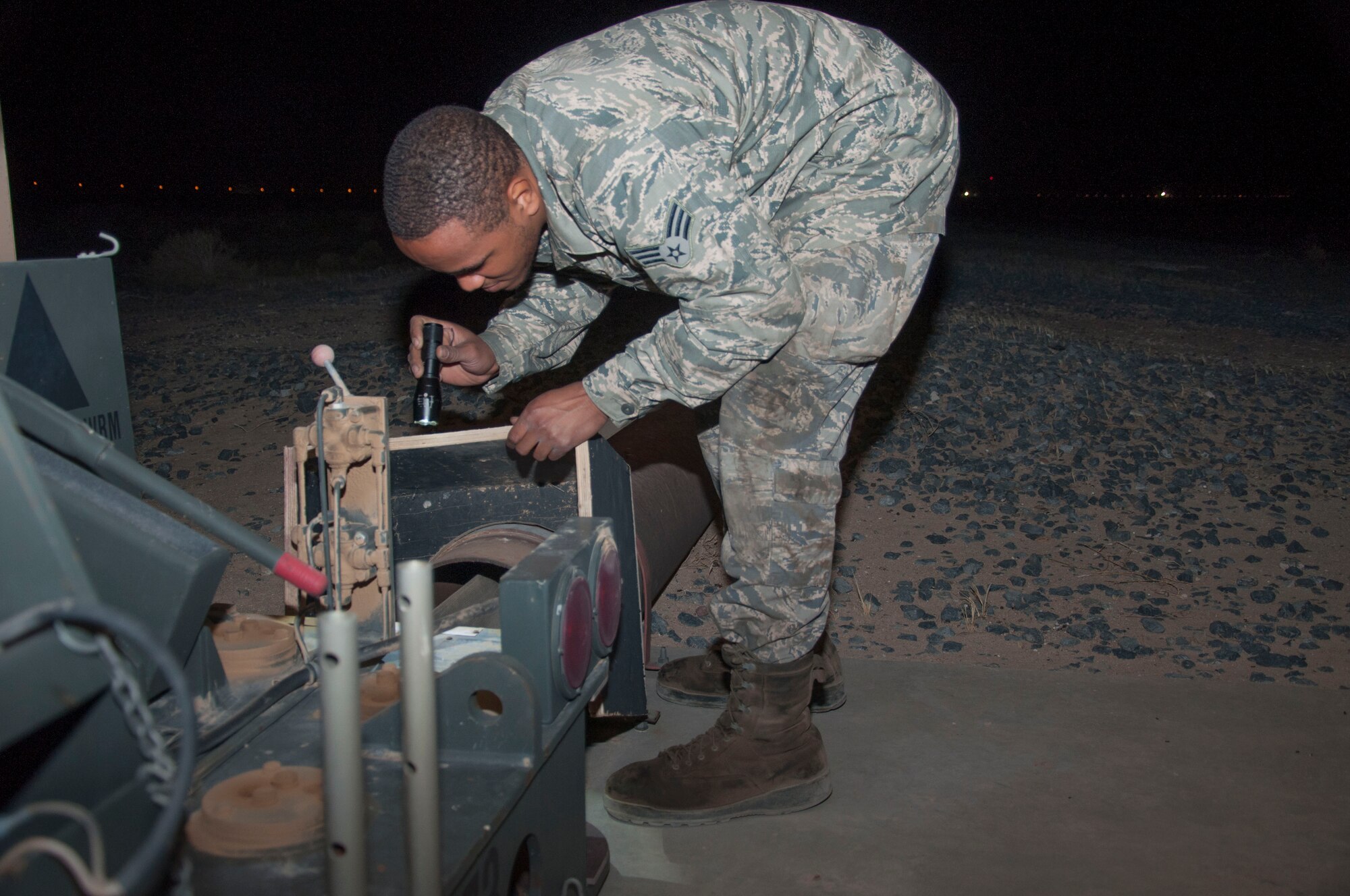 Senior Airman Quentin Palmore, a power production specialist assigned to the 386th Expeditionary Civil Engineer Squadron, conducts and inspection on a mobile aircraft arresting system at an undisclosed location in southwest Asia, June 24, 2017. A visual inspection is performed on these units daily. (U.S. Air Force Photo by Master Sgt. Eric M. Sharman)