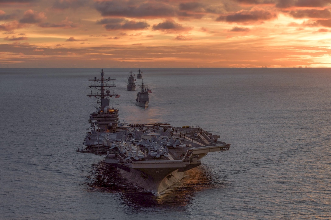 Ships assigned to the Navy’s Carrier Strike Group 5 sail in formation during a coordinated live-fire gunnery exercise in the South Pacific, June 29, 2017. Navy photo by Petty Officer 2nd Class Nathan Burke