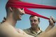 Belgian Medical Component 1st Lt. Olivier, a physical therapist, examines a pilot from the 332nd Air Expeditionary Wing as he performs neck exercises June 22, 2017, in Southwest Asia. Aircrew from the 332nd AEW received treatment for pains associated with flying high performance aircraft through a partnership program with the Belgian Medical Component. (U.S. Air Force photo/Senior Airman Damon Kasberg)