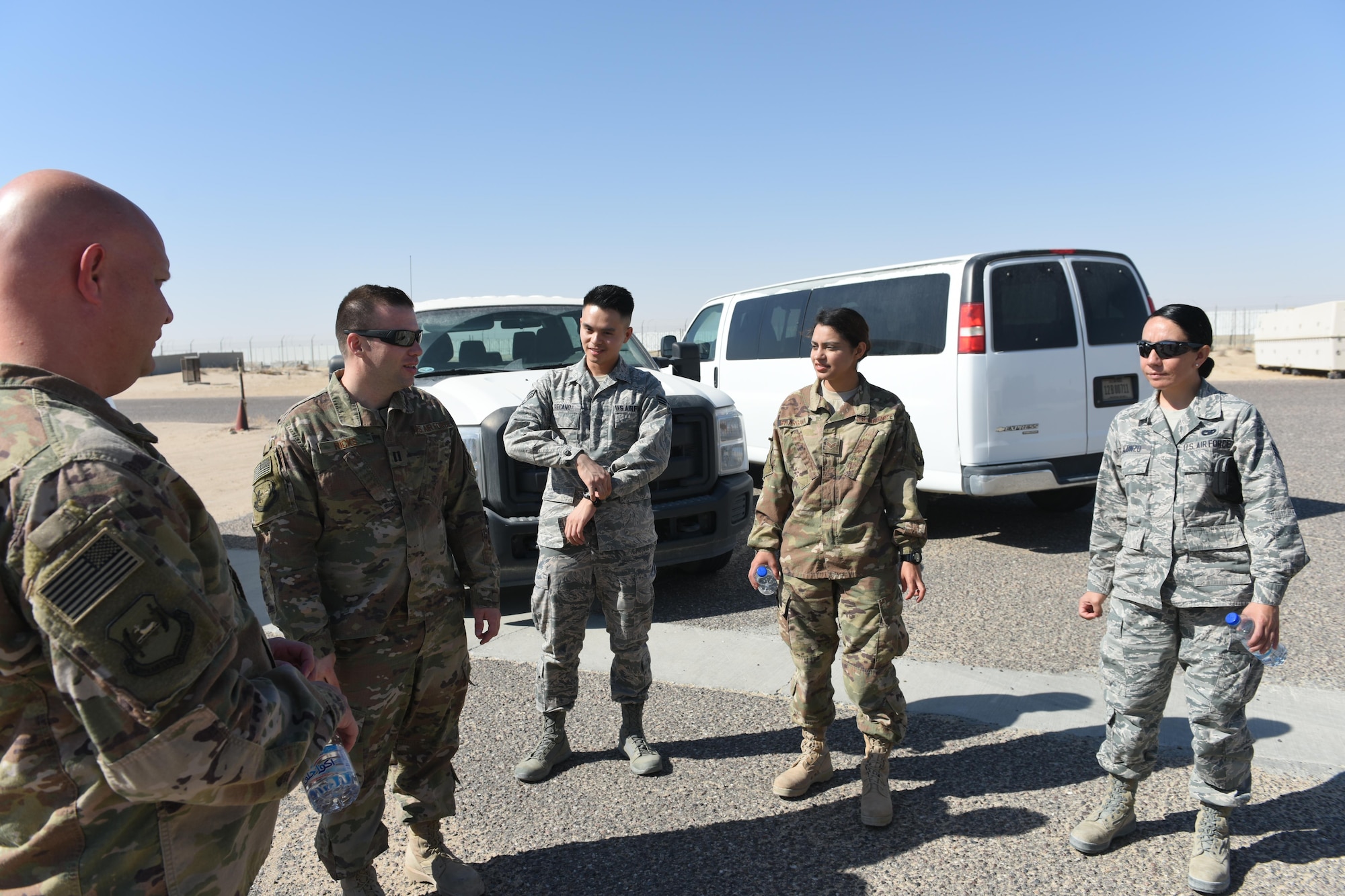Capt. Donovan Ricks (second from left), a maintenance operations officer with the 386th Expeditionary Maintenance Squadron, conducts a brief on the 386th Air Expeditionary Wing’s flying mission at an undisclosed location in Southwest Asia, June 27, 2017. The 386th Expeditionary Maintenance Group hosted a “Rock to Quarry” connection tour as an opportunity for Airmen, whose duties do not typically involve flightline access, to see how their job supports the overall wing’s flying mission. (U.S. Air Force photo by Tech. Sgt. Jonathan Hehnly)