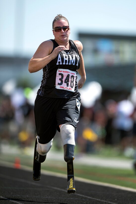 Army veteran Sgt. Christina Gardner runs in a race during the 2017 Department of Defense Warrior Games at Lane Technical College Preparatory High School in Chicago, July 2, 2017. DoD photo by EJ Hersom