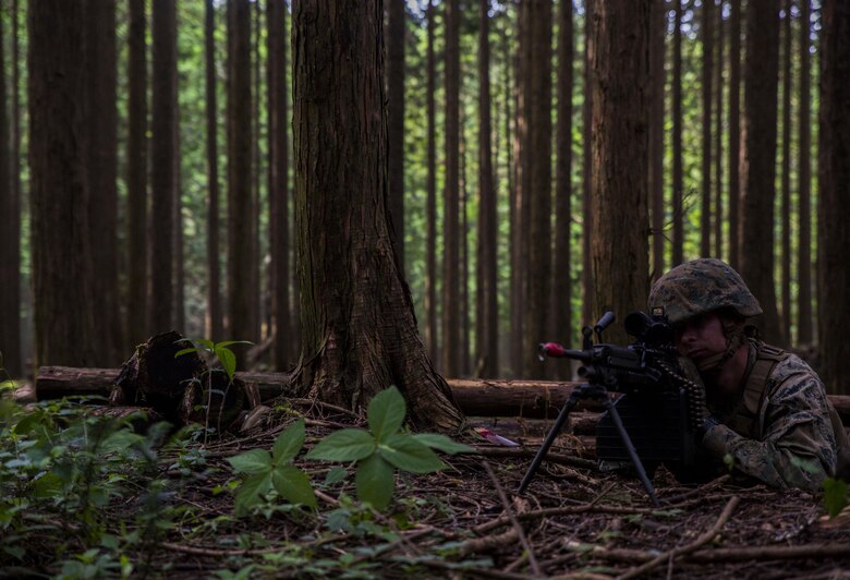 U.S. Marine Corps Cpl. Zach Clatterbuck, a motor transport Marine attached to Marine Wing Support Squadron (MWSS) 171, based out of Marine Corps Air Station Iwakuni, positions himself in a machine gun nest to provide security for a forward operating base during exercise Eagle Wrath 2017 at Combined Arms Training Center Camp Fuji, Japan, June 24, 2017. Forward operating bases and forward arming and refueling points were established during the two-week exercise to train the Marines to provide explosives, weaponry, fuel, security, logistics and personnel to a forward line of troops and aircraft. (U.S. Marine Corps photo by Lance Cpl. Stephen Campbell)