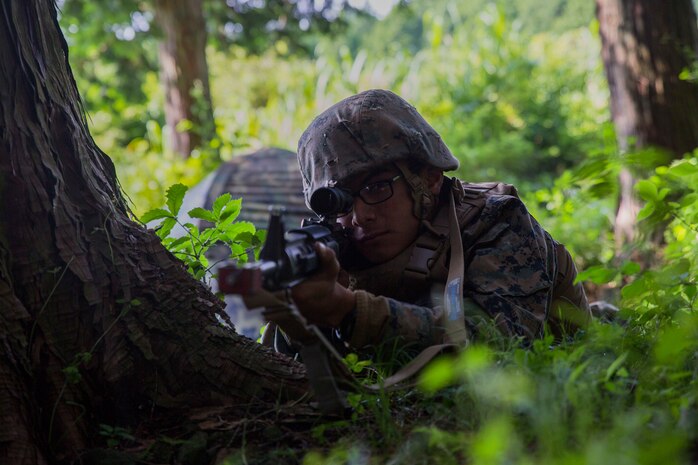 U.S. Marine Corps Pfc. Julian Rivera, an electrician attached to Marine Wing Support Squadron (MWSS) 171, based out of Marine Corps Air Station Iwakuni, provides security to a forward operating base during an immediate action drill while participating in exercise Eagle Wrath 2017 at Combined Arms Training Center Camp Fuji, Japan, June 24, 2017. Forward operating bases and forward arming and refueling points were established during the two-week exercise to train the Marines to provide explosives, weaponry, fuel, security, logistics and personnel to a forward line of troops and aircraft. (U.S. Marine Corps photo by Lance Cpl. Stephen Campbell)
