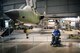 Bill Nolte sits below a an F-105G ‘Wild Weasel on June 11, 2017 in the Southeast Asia War Gallery at the National Museum of the U.S. Air Force.  He oversaw maintenance this plane during his 18-year career as an aircraft maintenance officer. (Photo contributed by Jason Nolte)