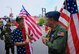 At right, the commander of the 932nd Airlift Wing's Operations Group, Col. Ray Smith, talks history with retired 932nd AW public affairs specialist Tech. Sgt. Daniel Oliver.  They and other wing Airmen past and present, met up early in the morning July 1, 2017, to assemble and prepare for the Saint Louis VP parade.  In talking about the unit they remembered wing lineage and special event memories before the start of the big 