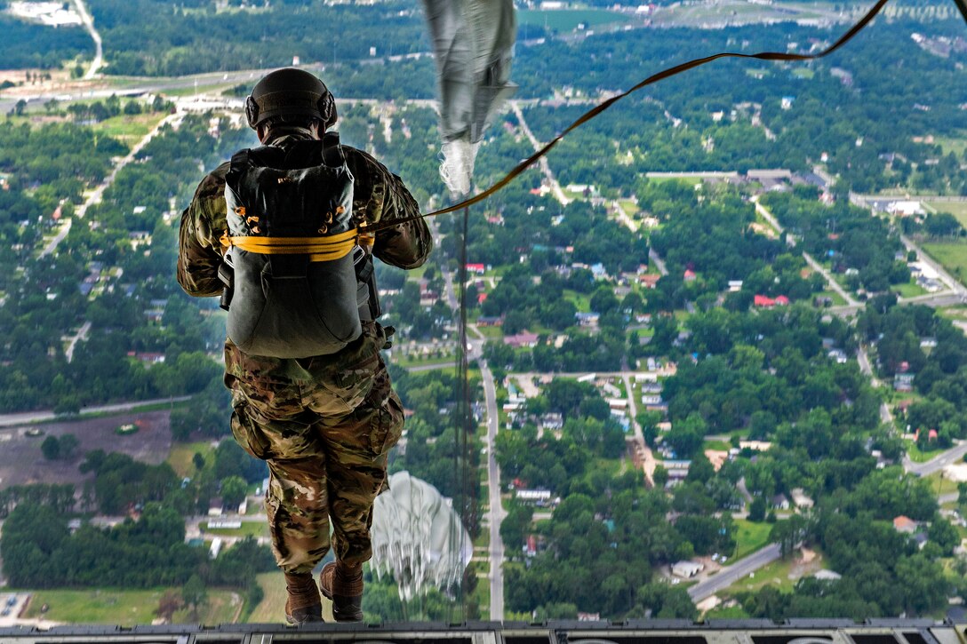 Air Force Capt. Clayton Yeung jumps from an HC-130J Combat King II aircraft during an airborne exercise over Moody Air Force Base, Ga., June 27, 2017. Yeung is a physician's assistant assigned to the 822nd Base Defense Squadron. Air Force photo by Tech. Sgt. Zachary Wolf