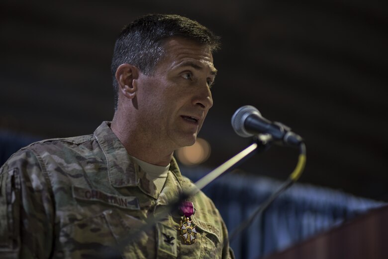 Col. John W. Chastain III, 332nd Expeditionary Maintenance Group commander, gives a speech during a change of command ceremony July 1, 2017, in Southwest Asia. Chastain was presented the Legion of Merit for his accomplishment while leading the 332nd EMXG. (U.S. Air Force photo/Senior Airman Damon Kasberg)
