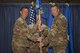 Brig. Gen. Kyle W. Robinson, 332nd Air Expeditionary Wing commander, left, passes the guidon to Col. Shane A. Barrett, during the 332nd Expeditionary Maintenance Group change of command ceremony July 1, 2017, in Southwest Asia. The passing of a guidon symbolizes a unit’s transfer of command. (U.S. Air Force photo/Senior Airman Damon Kasberg)