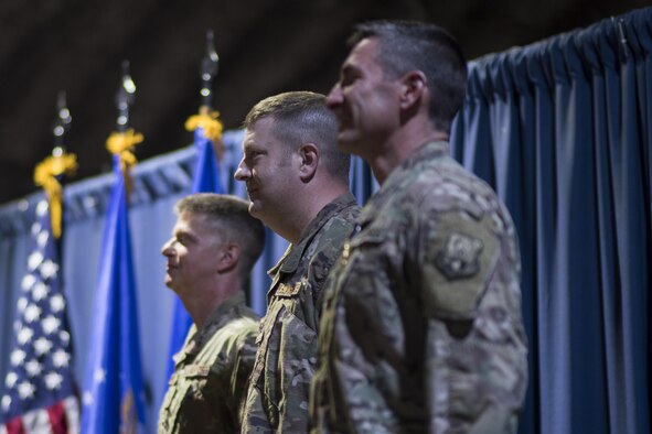 Col. Shane A. Barrett, Expeditionary Maintenance Group commander, sings the Air Force song during a change of command ceremony May 31, 2017 in Southwest Asia. Prior to taking command, Barrett was the commander of the 23rd Maintenance Group, at Moody Air Force Base, Ga. (U.S. Air Force photo/Senior Airman Damon Kasberg)