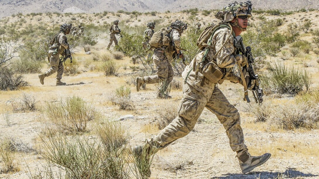 Marines move to conduct a simulated assault outside the Alpine Pass at the National Training Center at Fort Irwin, Calif., June 30, 2017. The Marines are assigned to Echo Company, 2nd Battalion, 4th Infantry Regiment. Army photo by Pfc. Austin Anyzeski