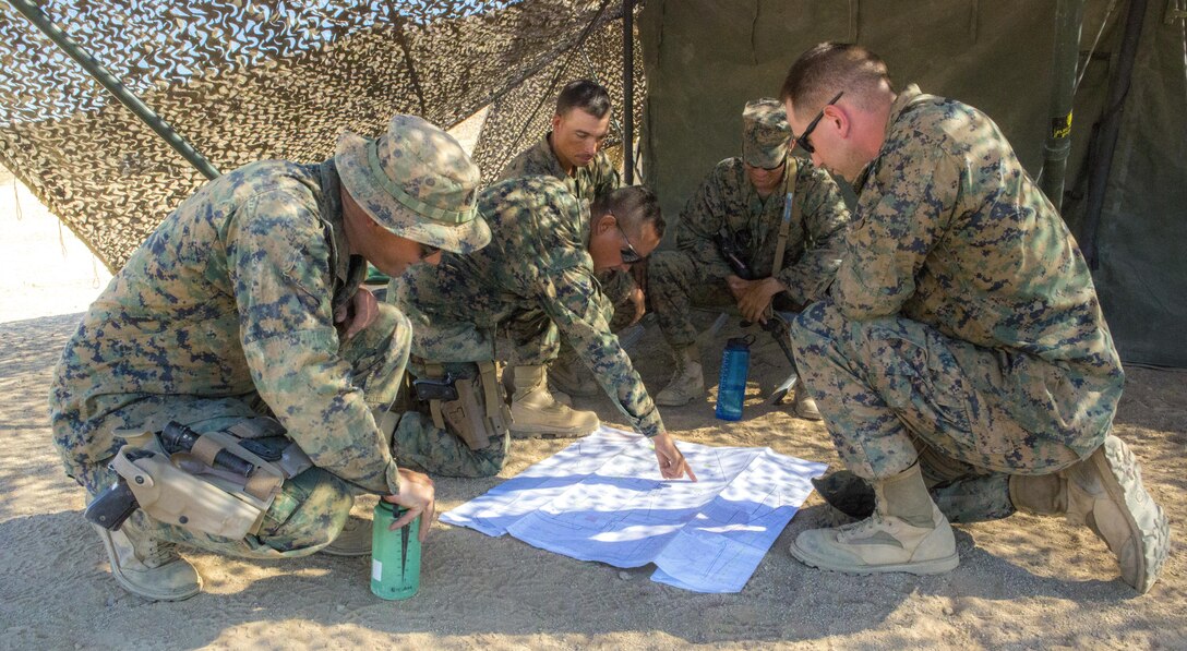 TWENTYNINE PALMS, Calif. – Marines with Combat Logistics Battalion 453, Combat Logistics Regiment 4, 4th Marine Logistics Group, Marine Forces Reserve, plan the best route to transport medical equipment between forward aid stations during Integrated Training Exercise 4-17 in Twentynine Palms, California on June 23, 2017. The Marines relocated the battalion aid station to maintain close proximity with 2nd Battalion, 25th Marine Regiment, 4th Marine Division, MARFORRES, decreasing the chance of heat causalities during the final battalion exercise of ITX 4-17.
