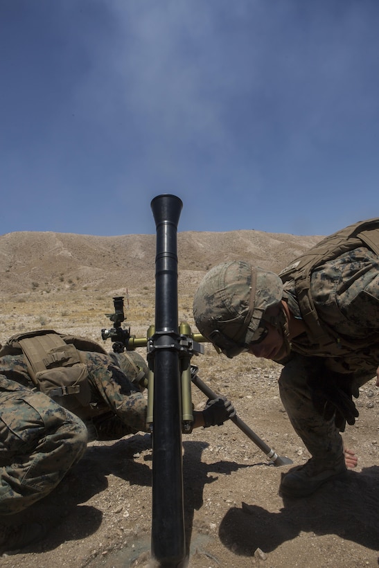 U.S. Marine Corps Lance Cpl. Carlos Jimenez, left, and Cpl. Gerry Potempa, mortarmen with Weapons Company, 2nd Battalion, 24th Marine Regiment, 4th Marine Division, Marine Forces Reserve, conduct fire support with the 60mm light mortar during the Fire Support Coordination Exercise, a training event, during the Integrated Training Exercise 4-17 at Camp Wilson, Marine Corps Air Ground Combat Center, Twentynine Palms, California on June 26th, 2017.  ITX 4-17 focused on the practical application of combined-arms maneuver warfare in preparation to support the active component across a range of military operations. (U.S. Marine Corps photo by Lance Cpl. Imari J. Dubose/Released)